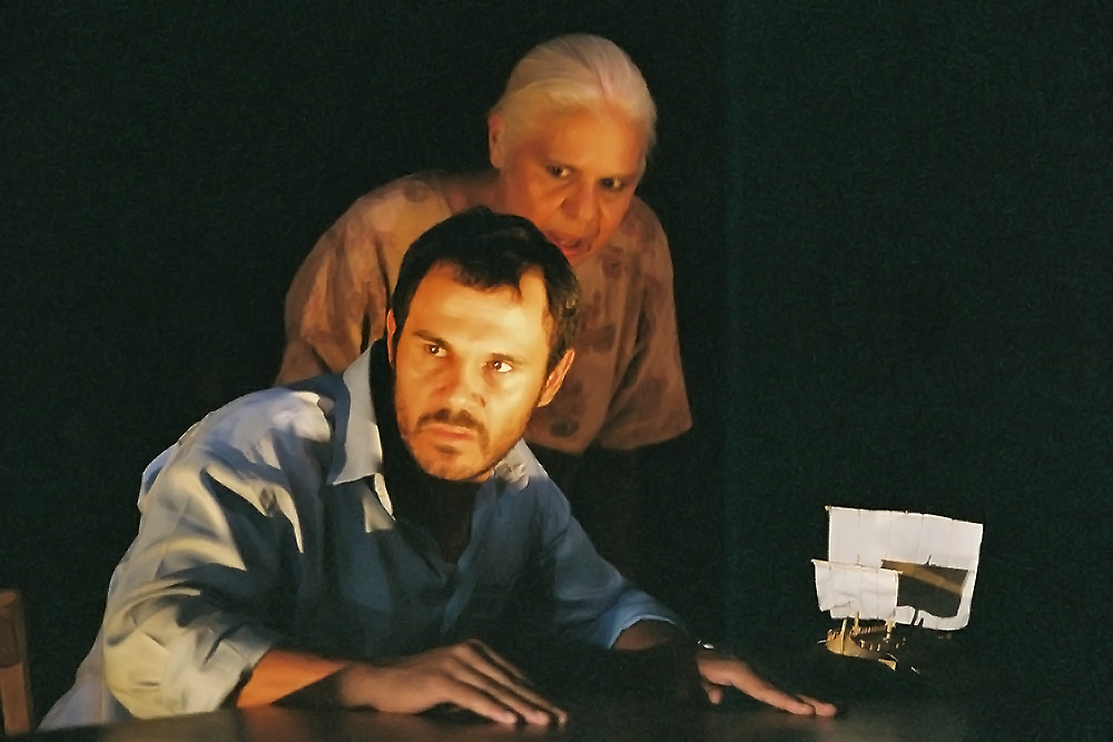 Production still for Belvoir St production of "Black Medea". L-R: Aaron Pederson as Jason, Justine Saunders as the Chorus. Photographer: Heidrun Lohr