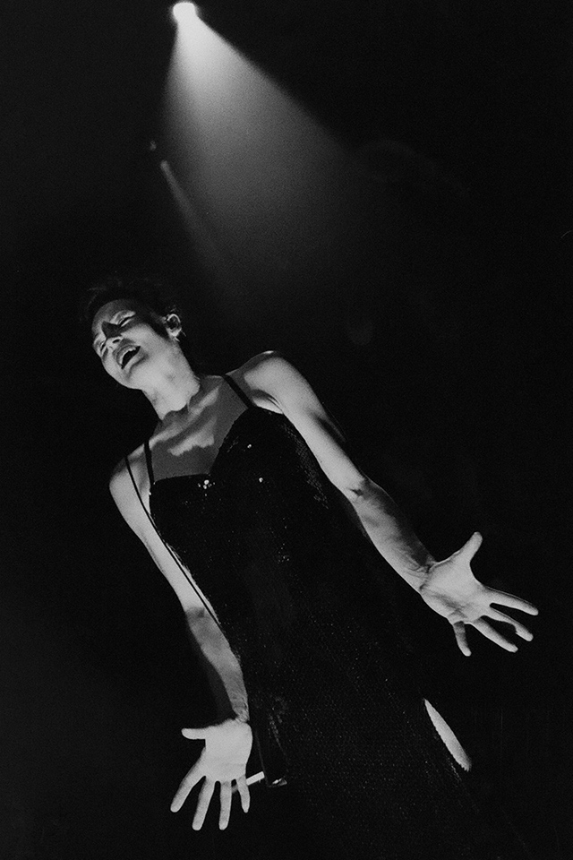 Production still for "The Black Sequin Dress". Margaret Mills. Photographer: Jeff Busby