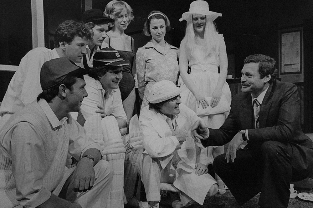 Production still for "Outside Edge". Sporting legend Ron Barassi (far right) talking with the cast. Photographer: Jeff Busby