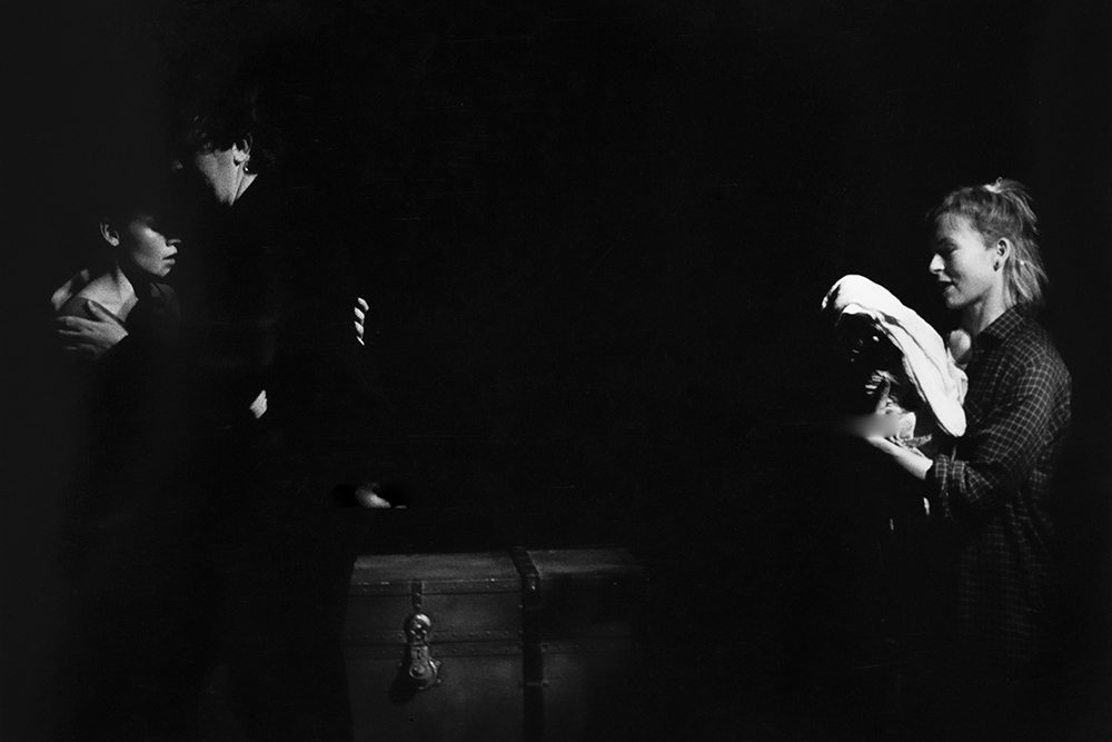 Production still for "The Conjurers". L-R: Maya Stange as Gala, David Wicks as the Sea Captain, Margaret Mills as Beth. Photographer: Jeff Busby